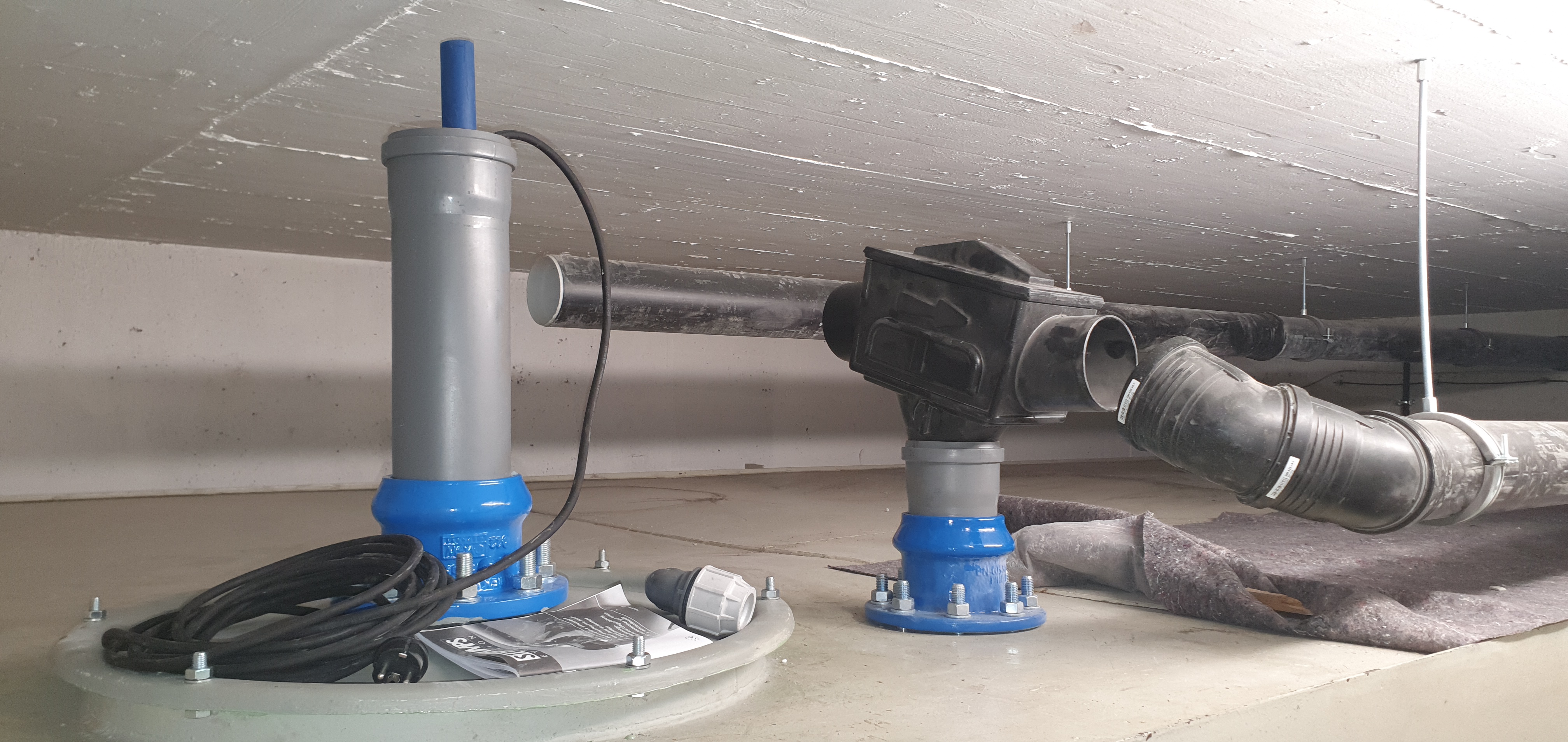 View of the filter unit and extraction opening on a basement-welded tank for water storage